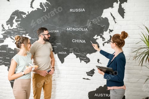 Preview: Couple with travel agent at the office