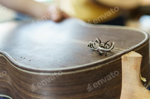 Preview: Unrecognizable Spanish flamenco guitar luthier crafting guitar part