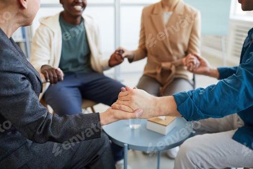 Preview: People Holding Hands in Support Group Close up