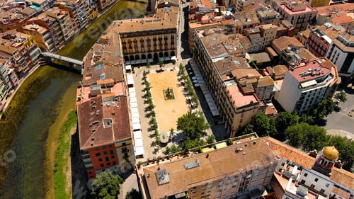 Preview: Aerial view of Girona city skyline and Plaça de la Independència in the historic old town square