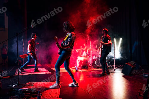 Preview: Rock and roll group performing live.