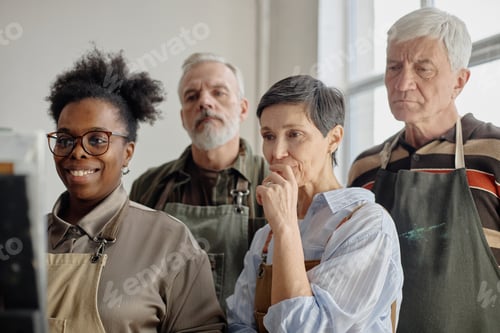 Preview: Diverse Middle Aged Adults Observing Educational Presentation in Art Class