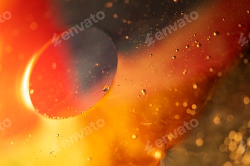 Preview: Oil in water, abstract background in yellow,orange and red color tones