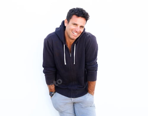 Preview: Handsome middle aged guy laughing against white background