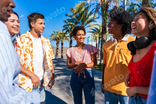 Preview: Multiethnic group of young happy friends hanging out