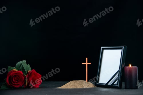 Preview: front view of little grave with candle and picture frame on dark background funeral death