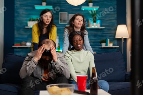 Preview: Angry man and multi ethnic friends upset after losing games competition
