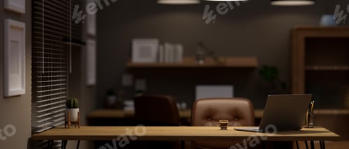Preview: Copy space on wooden desk with laptop, coffee cup and decor in modern home office at night