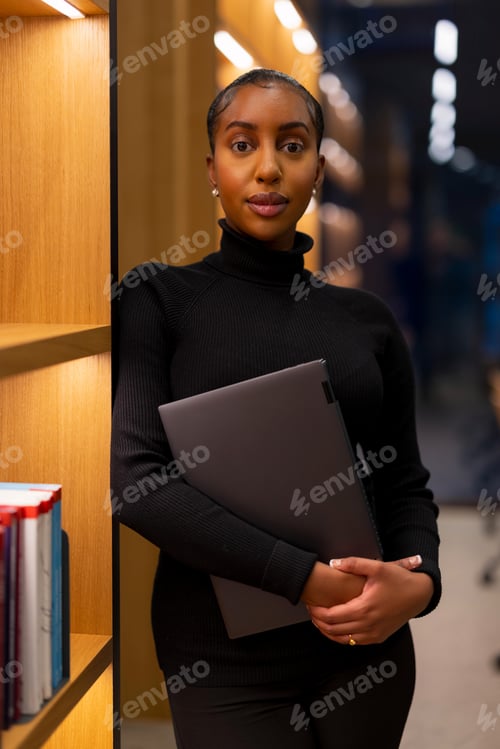 Preview: Student studying at a modern library