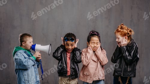 Preview: Studio shoot of child with megaphone shouting at other children.