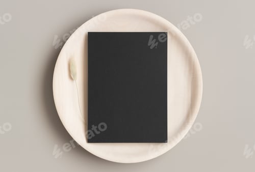 Preview: Black invitation card mockup on a wooden plate with a lagurus. 5x7 ratio, similar to A6, A5.