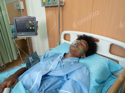 Preview: At hospital intensive care unit patient in coma lay on bed unconsciousness breathing to oxygen mask