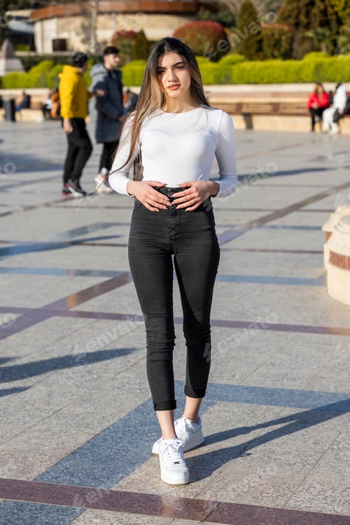 Preview: vertical portrait of young girl stand on at the street