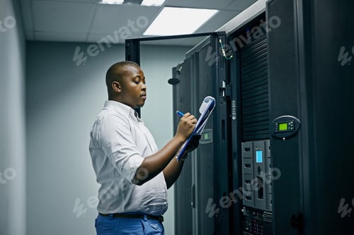 Preview: Shot of an IT technician doing inspections in a data center