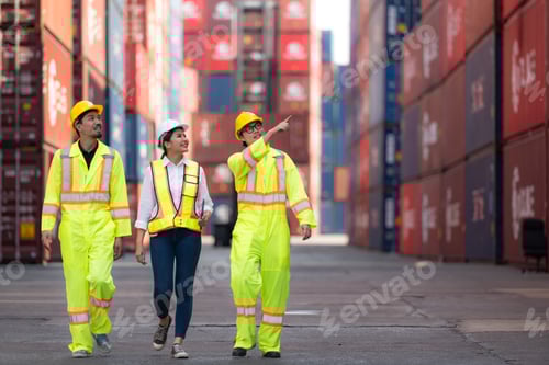Preview: Group of engineers working with laptop in the container yard.