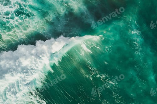 Preview: Aerial wave background. Drone shot directly from above, green turquoise color, huge waves