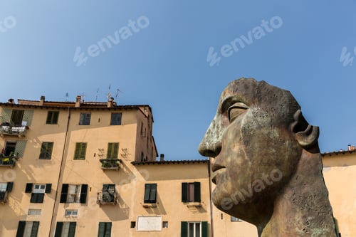 Preview: sculpture of head in historical mediterranean city, Pisa, Italy