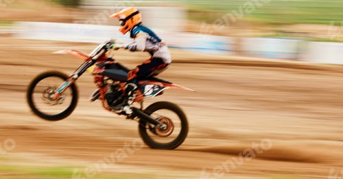 Preview: Motorcycle, balance and motion blur with a man training for a race or dirt biking challenge on spac