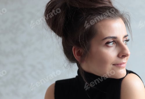 Preview: Elegant Woman with Hair Up Looking Sideways
