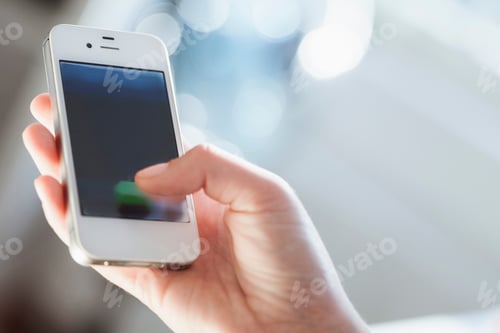 Preview: Young woman using smart phone, close up