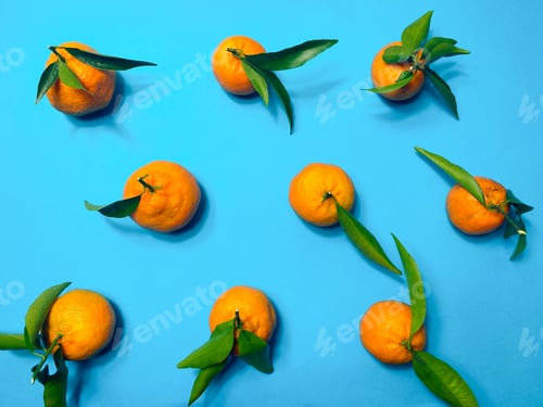 Preview: Fresh and ripe tangerines on blue background