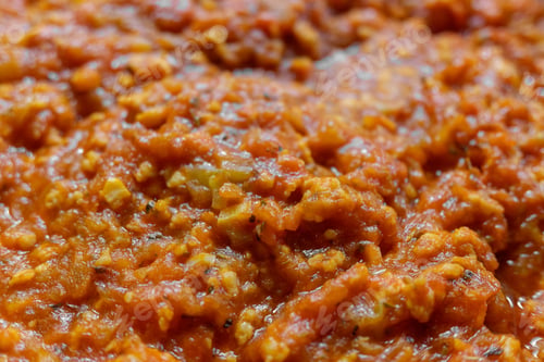 Preview: Detail of a fried vegetable sauce with tomato.