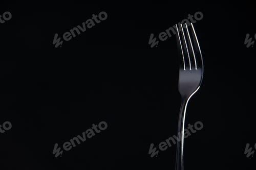 Preview: front view steel fork on black background copy place