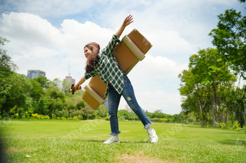 Preview: Portrait of kid in pilot costume holding wooden plane running in summer field. kid playing.