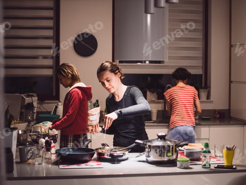 Preview: Friendly dinner, girls cooking in the kitchen