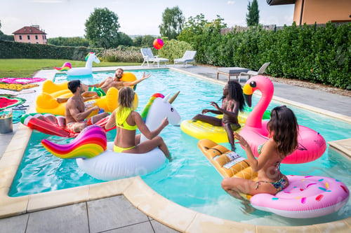 Preview: Friends having fun in a swimming pool