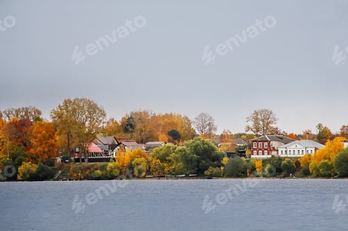 Preview: Cottages on the lake. Rural views of the beautiful homes in autumn.