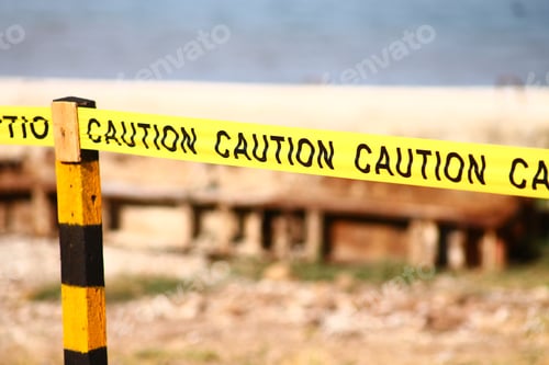 Preview: Closeup shot of yellow caution tape on a blurred background
