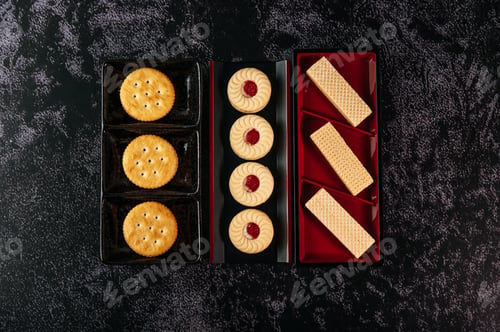 Preview: Many cookies are beautifully arranged in a plate and then placed on a wooden table.