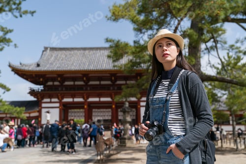 Preview: female looking into distance at todaiji temple