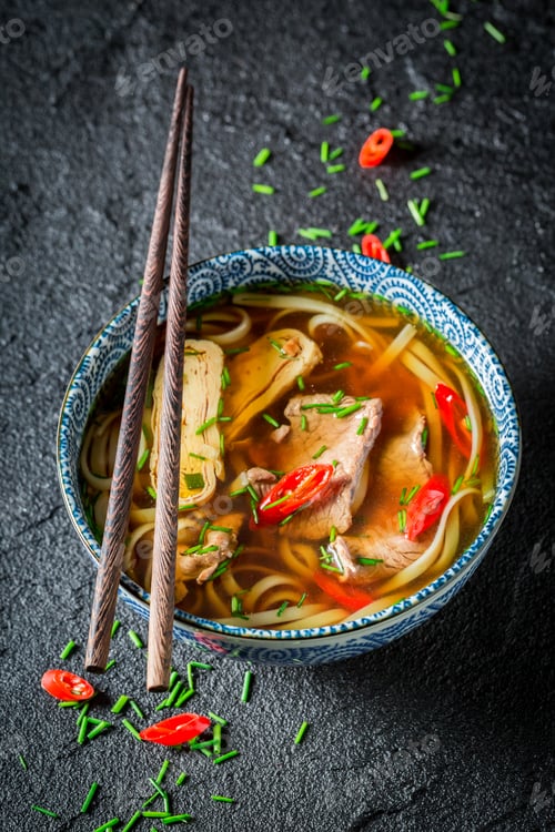 Preview: Hot Thai broth with beef and noodle on black rock