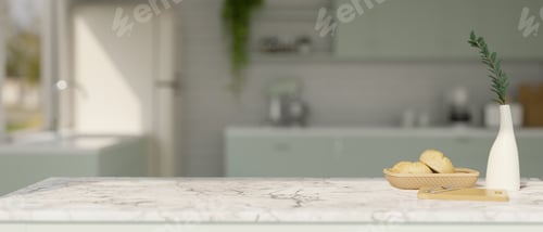 Preview: Luxury white marble tabletop with copy space over blurred beautiful kitchen in the background.