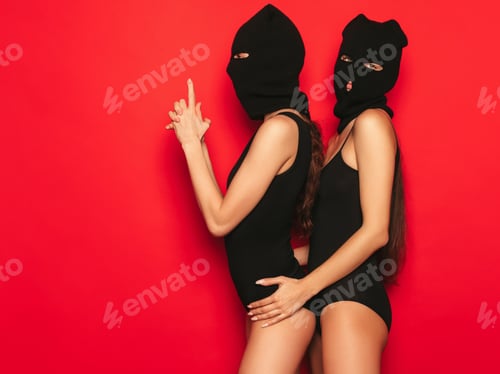 Preview: Portrait of two hot women posing in studio