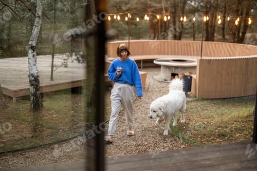 Preview: Woman walks at cozy backyard with luxury lounge area