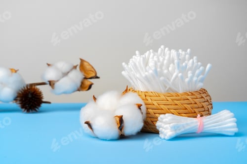 Preview: Set of cotton buds sticks on blue paper