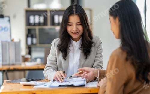 Preview: Asian female sales representatives in the section of Real estate talked and discussed tax plans to s