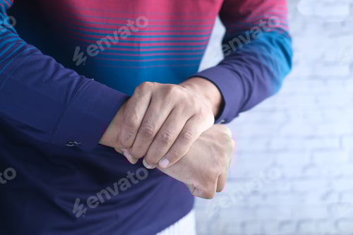 Preview: man suffering pain in hand close up