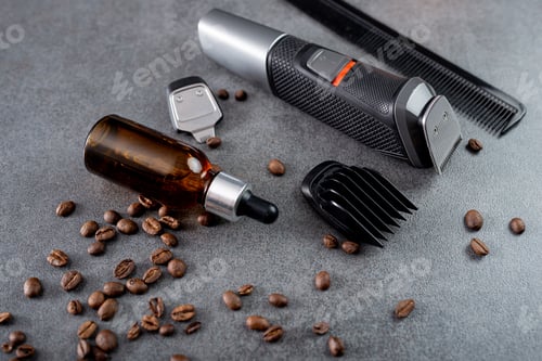 Preview: Trimmer with nozzles. Buying a new wireless trimmer. On a stone background. Close-up. With a space