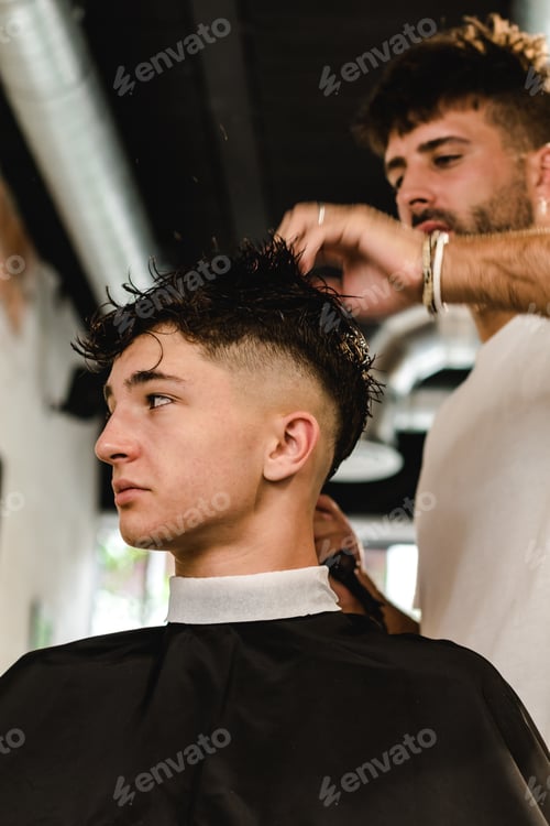 Preview: Men Hair Salon. Barber Doing Haircut In Barbershop. Young Male Client And Hairdresser.