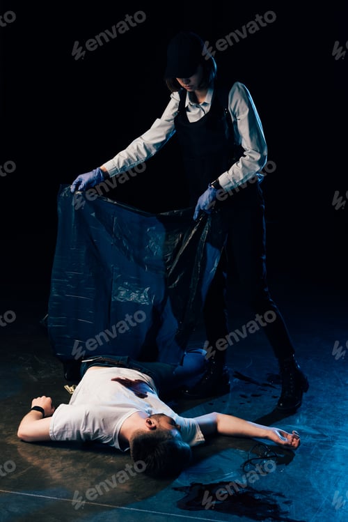 Preview: full length view of investigator covering dead body at crime scene