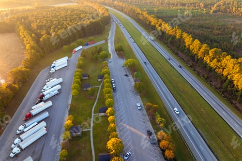 Preview: Large truck stop with resting area near busy American interstate freeway.