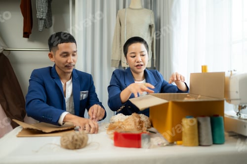 Preview: Two Young Adults Packing Orders for Shipping