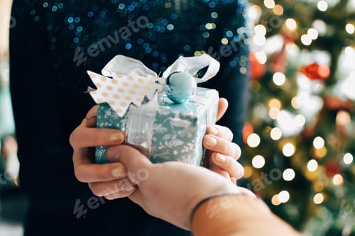 Preview: Man giving gift to woman