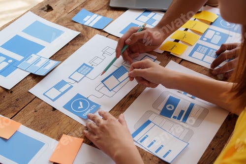 Preview: Group of ux developer and ui designer brainstorming about app interface design at modern office