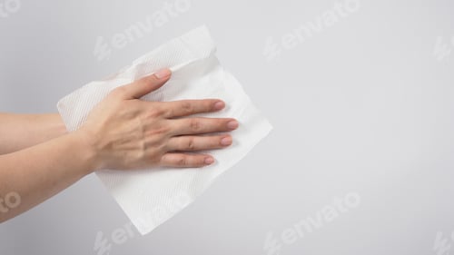 Preview: Male model is dry hands thoroughly with tissue paper on white background.