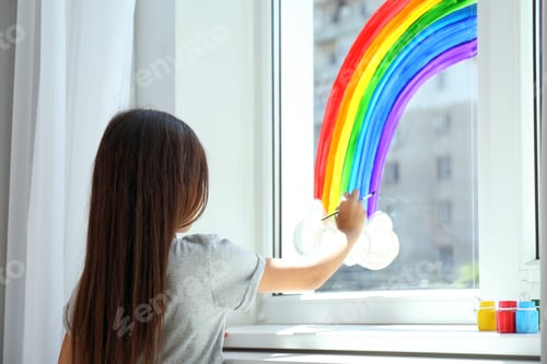 Preview: Little girl drawing rainbow on window indoors, back view. Stay at home concept